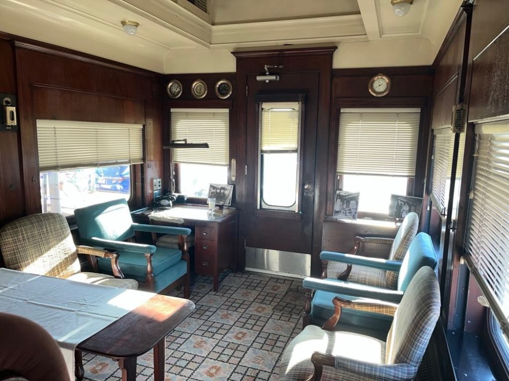 a living room filled with furniture and a large window