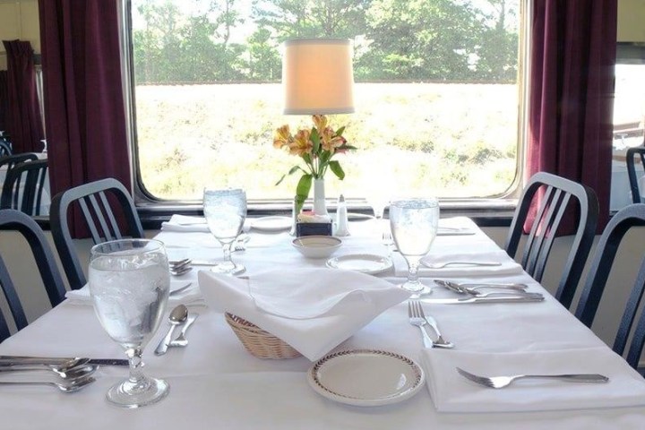 a dining table with a glass of wine