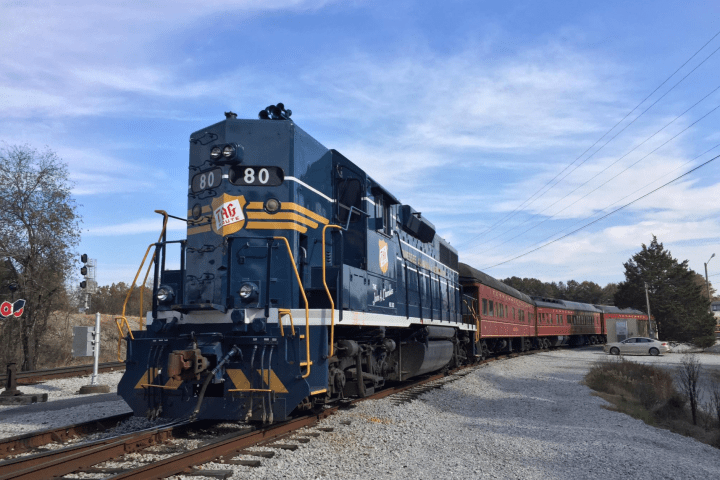 This 80 train engine is quite a sight to see. It's massive and can easily pull a few cars behind it. It's definitely something you don't see everyday!